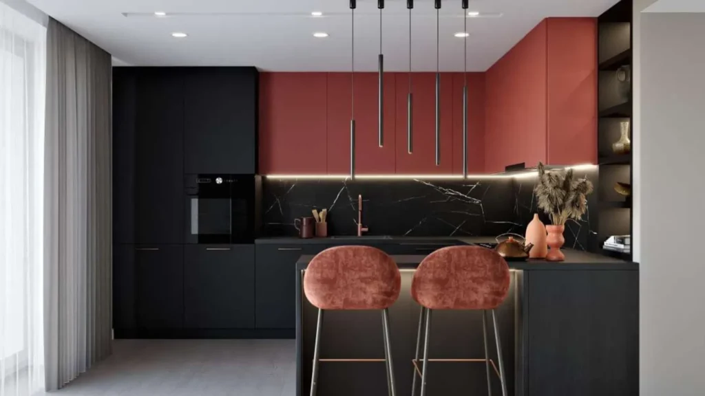 Nowoczesna kuchnia z wyspą w odcieniach czerni i terakoty, z eleganckim oświetleniem LED i wysokimi hokerami przy blacie.